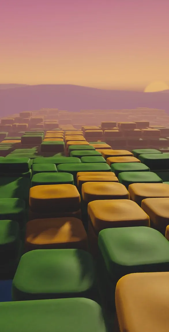 A calm evening over rows of green and golden squares, hills in the haze