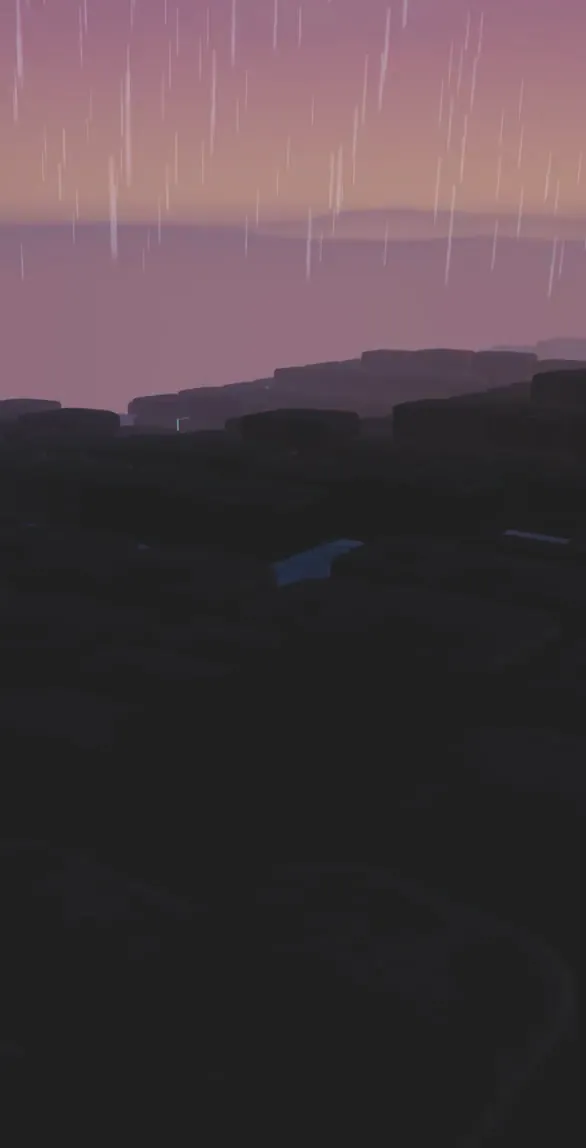 Rain falling over the dark, burned land